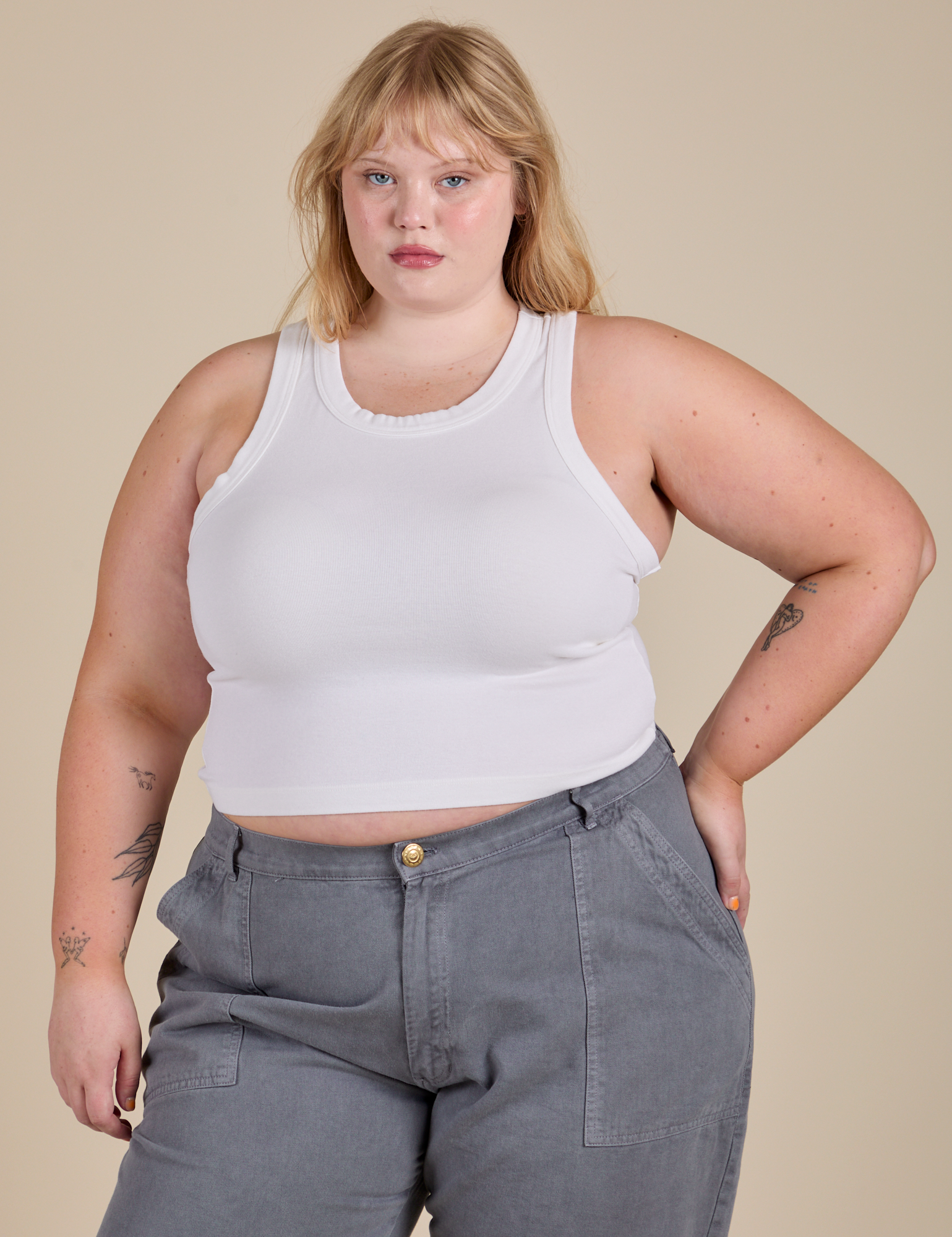 Juliet is 5’7” and wearing L Racerback Tank in Vintage Tee White