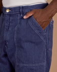 Close up of Railroad Denim Work Pants in Faded Grape Overdye on Isaac