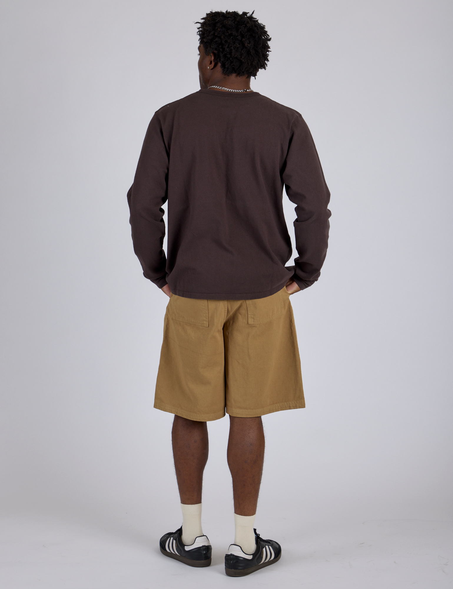 Back view of Longline Work Shorts in Desert Brown and espresso brown Long Sleeve Burly Tee on Isaac