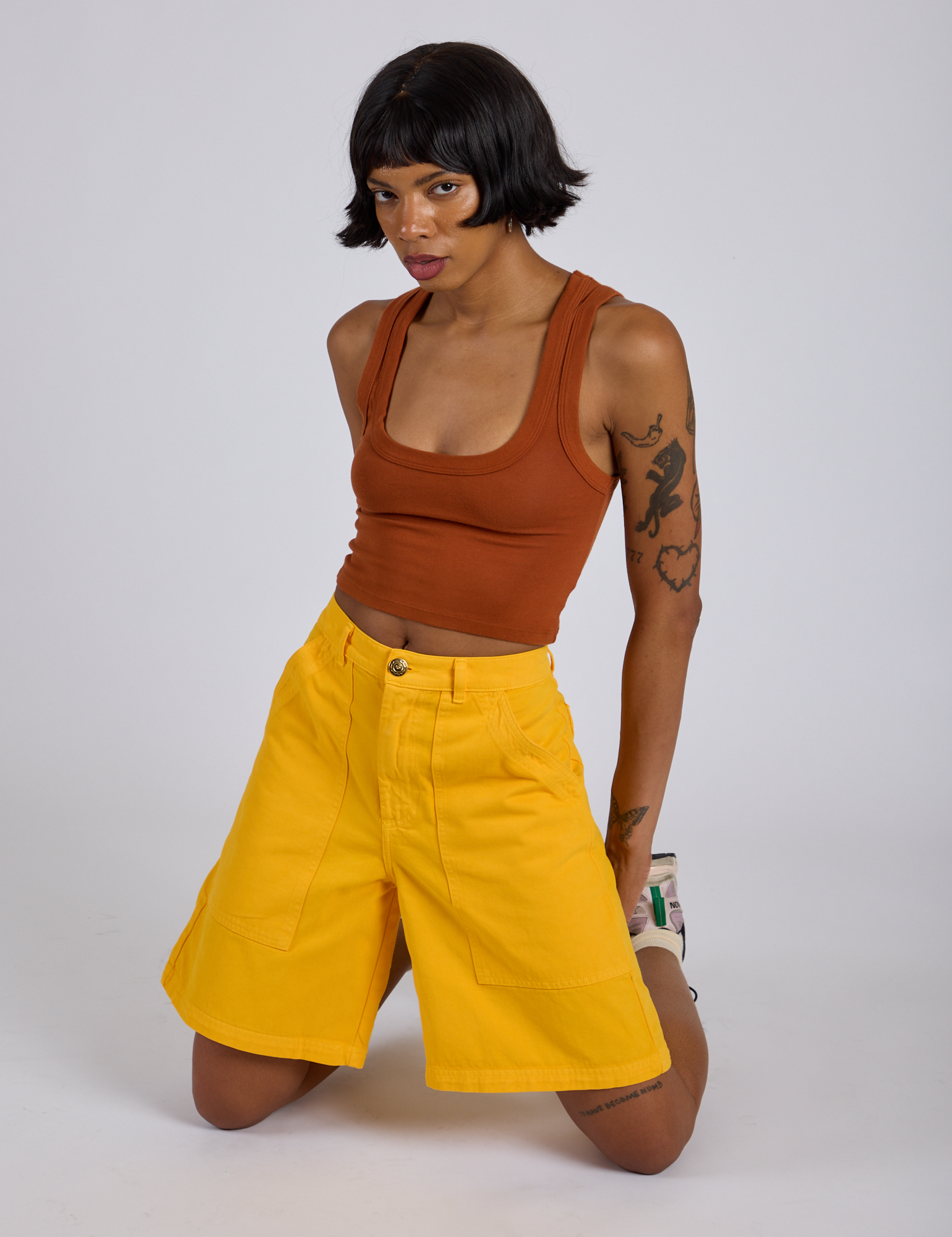 Longline Work Shorts in Sunshine Yellow and burnt terracotta Cropped Tank worn by Kira