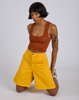 Longline Work Shorts in Sunshine Yellow and burnt terracotta Cropped Tank worn by Kira