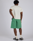 Back view of Longline Work Shorts in Seafoam Green and Burly Tee in Vintage Tee White on Isaac