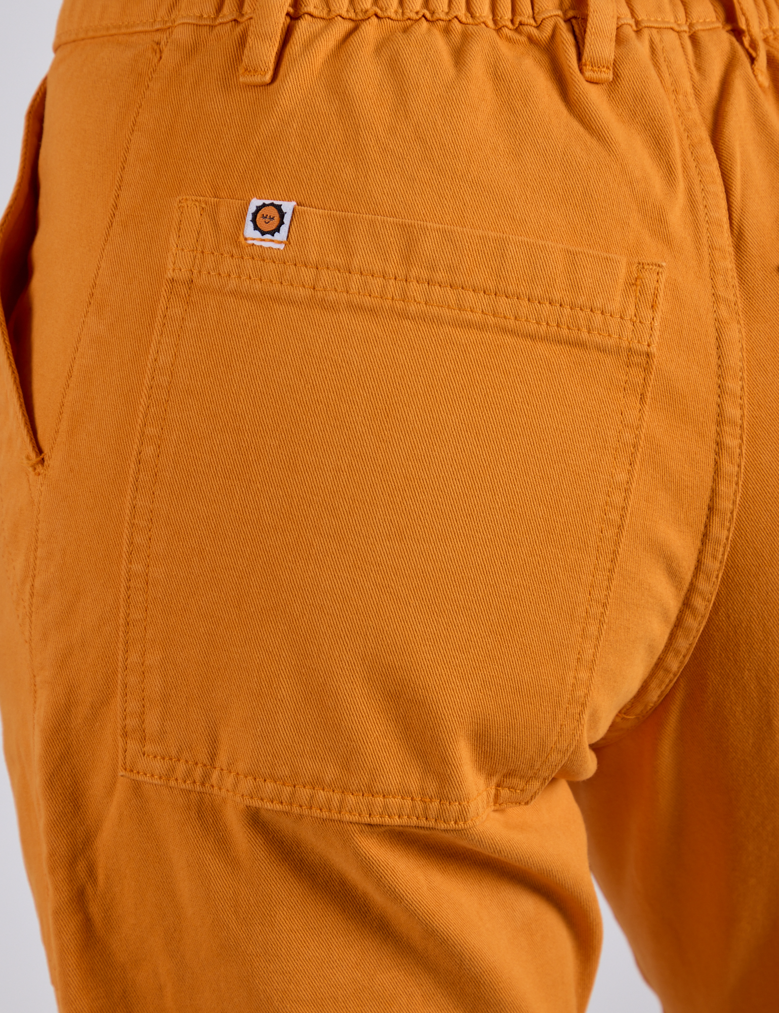 Work Pants in Creamsicle Orange back pocket close up