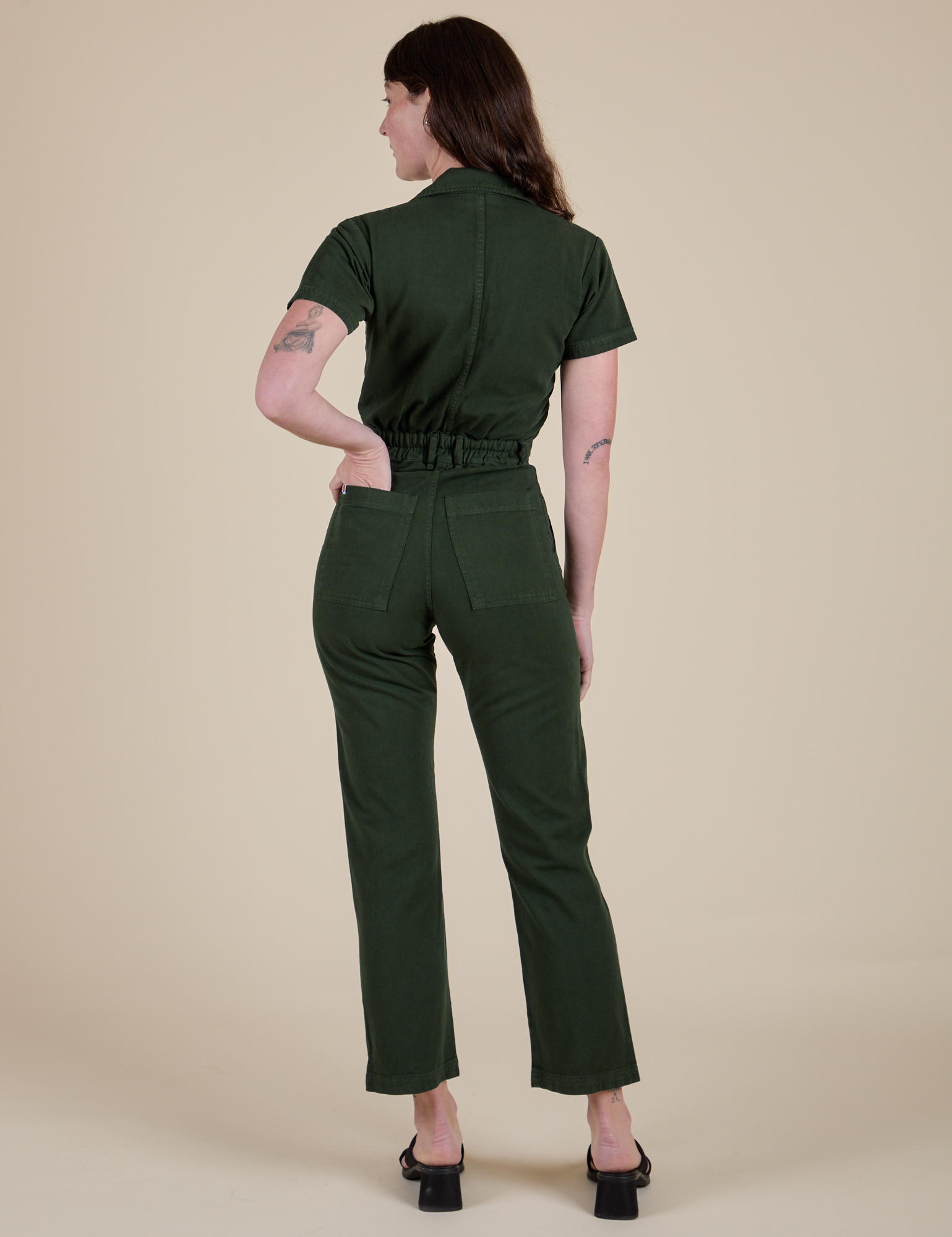 Back view of Short Sleeve Jumpsuit in Swamp Green on Alex