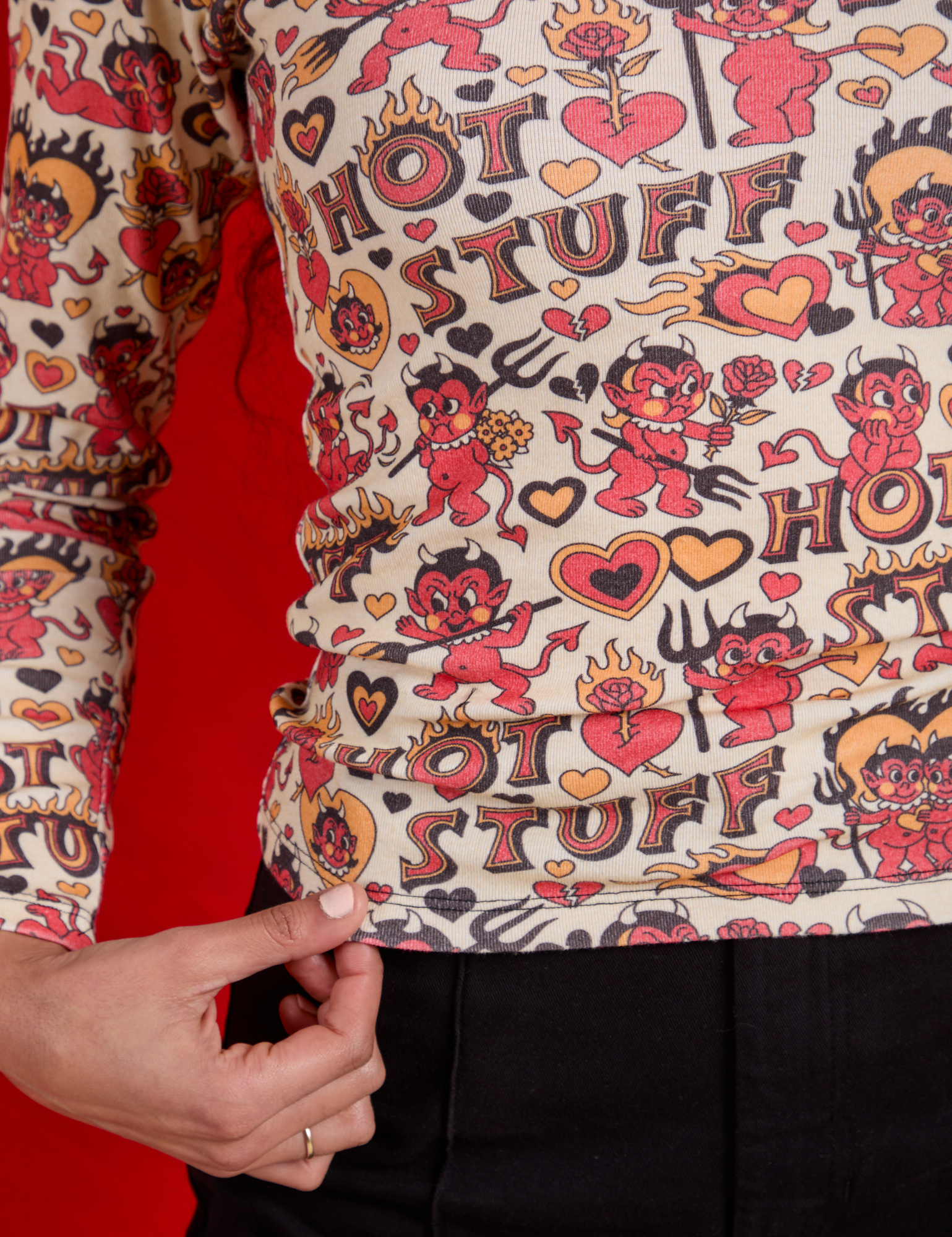 Long Sleeve Baby Tee in Hot Stuff Print close up on Shahana