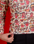 Long Sleeve Baby Tee in Hot Stuff Print close up on Shahana