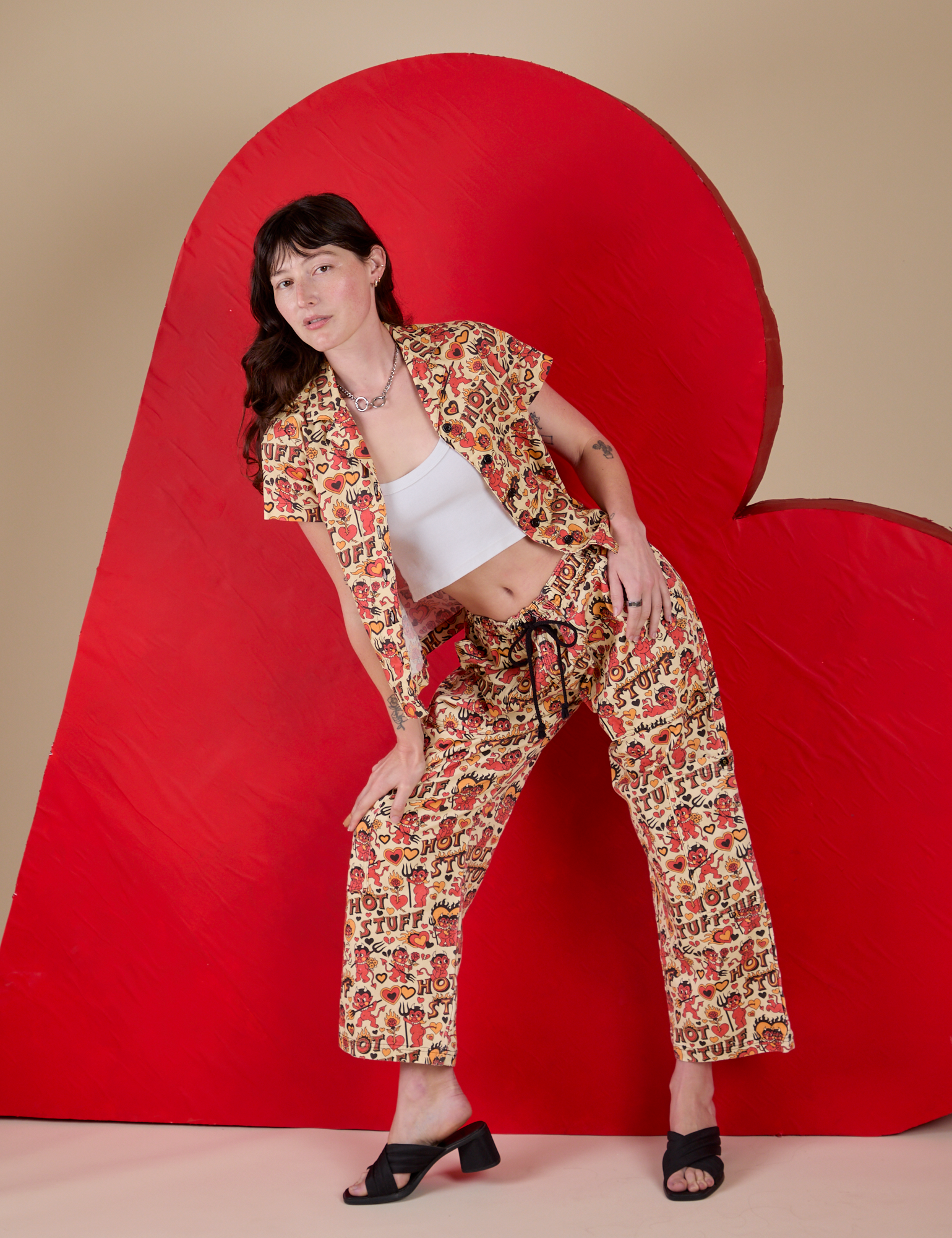Alex is 5’8” and wearing P Hot Stuff Print Pantry Button-Up paired with matching Drop Pocket Cargo Pants