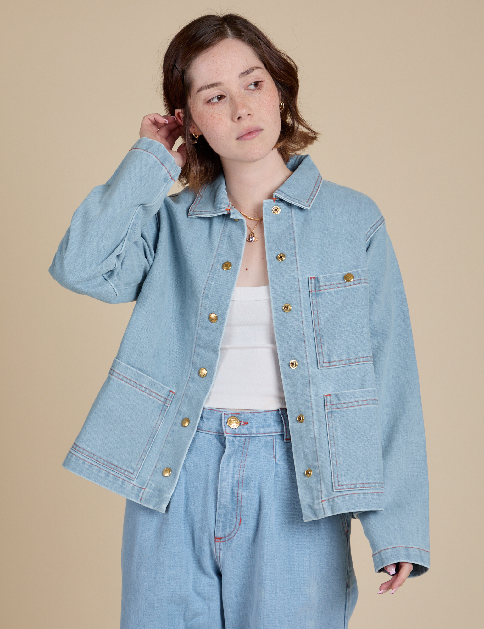 Hana is 5'3" and wearing P Indigo Denim Work Jacket in Light Wash