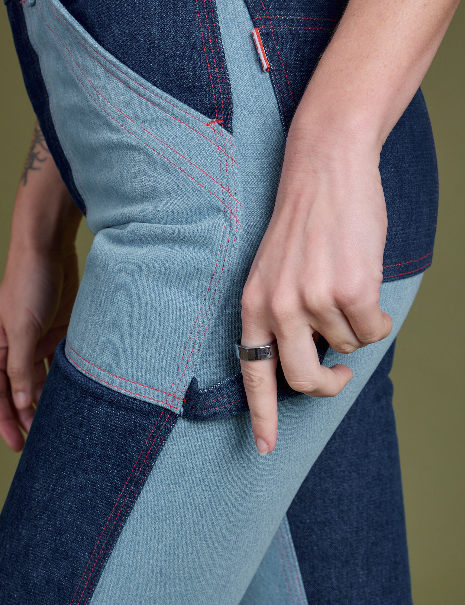 Pant leg side view close up of Mismatched Denim Carpenter Jeans on Alex