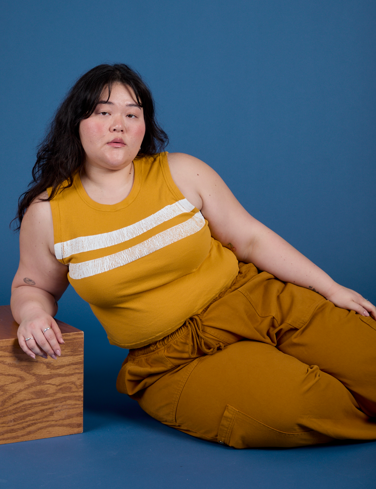Painted Muscle Tee in Mustard Yellow worn by Ashley