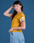 Painted Burly Tee in Mustard Yellow side view on Alex