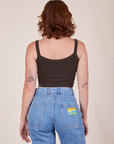 Back view of Cropped Cami in Espresso Brown and light wash Frontier Jeans worn by Alex
