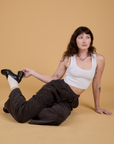 Alex is wearing Corduroy Drop Pocket Cargo Pants in Espresso Brown and Cropped Tank in Vintage Tee White