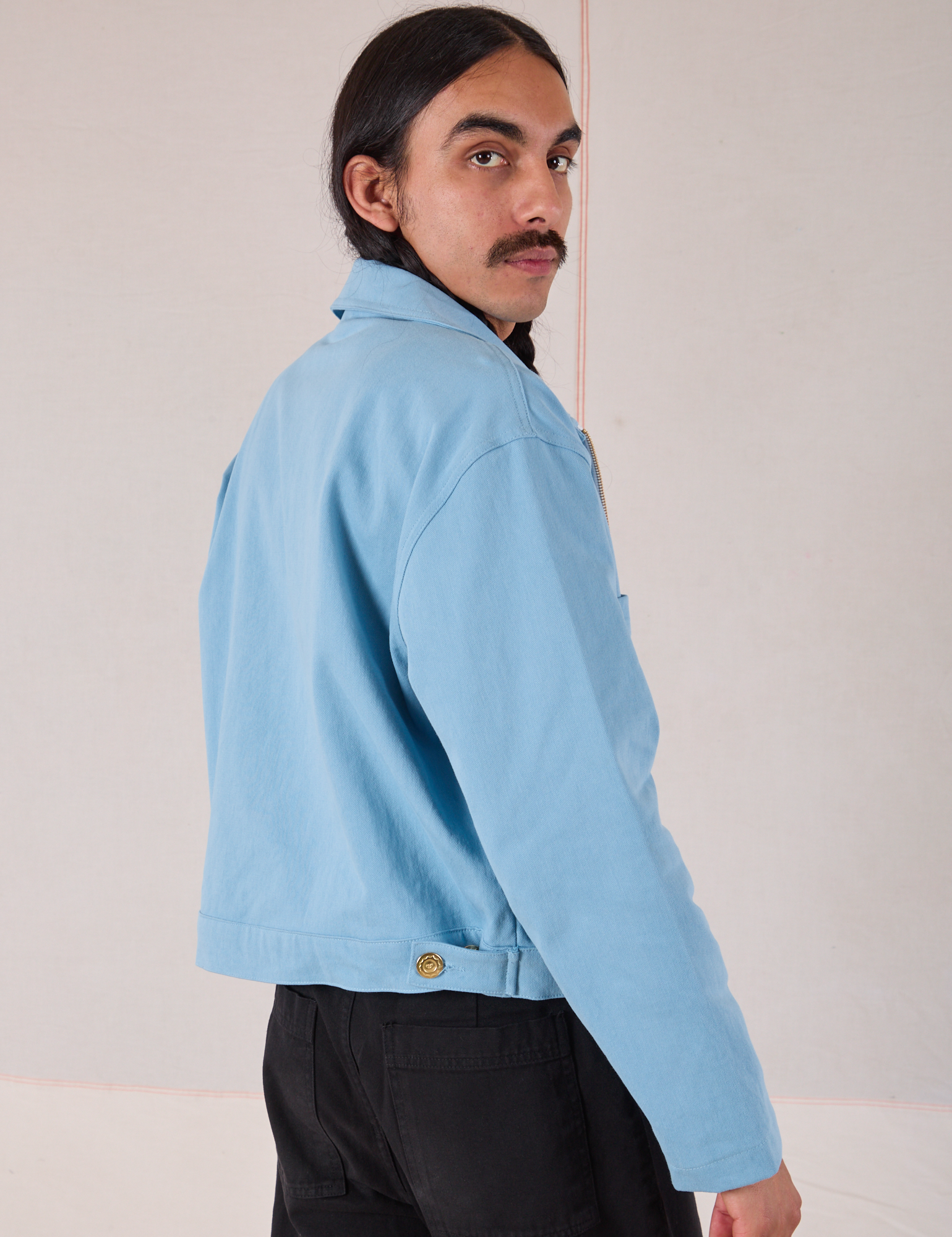 Mechanic Jacket in Baby Blue angled back view on Anthony