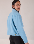 Mechanic Jacket in Baby Blue angled back view on Anthony