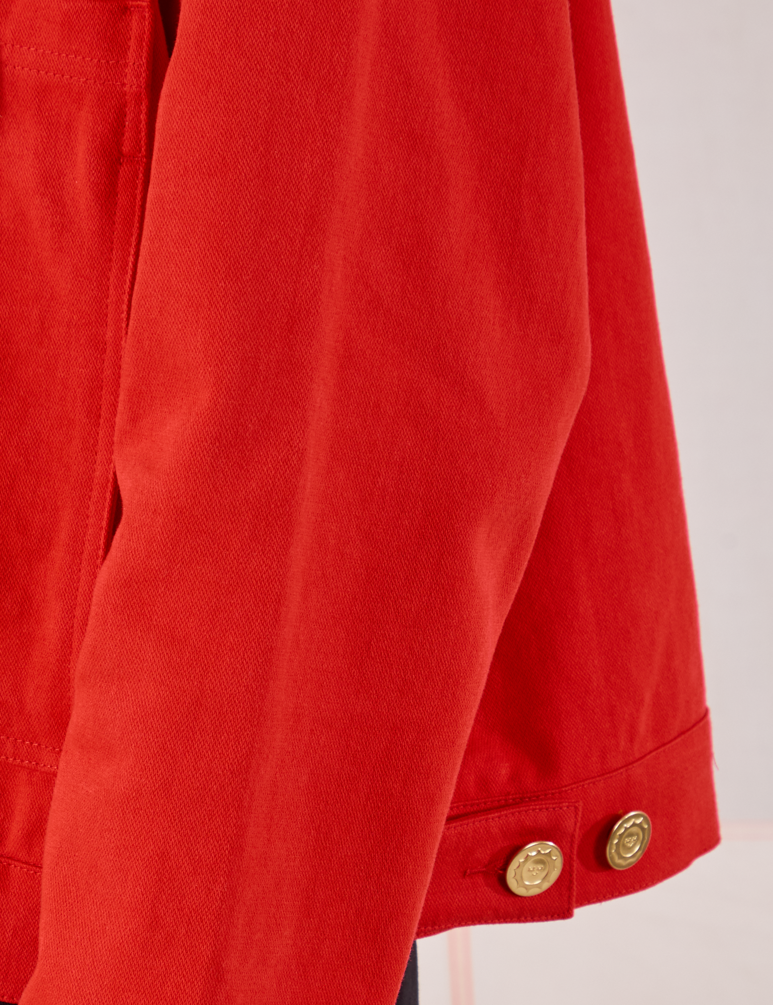 Mechanic Jacket in Mustang Red sleeve close up on Anthony