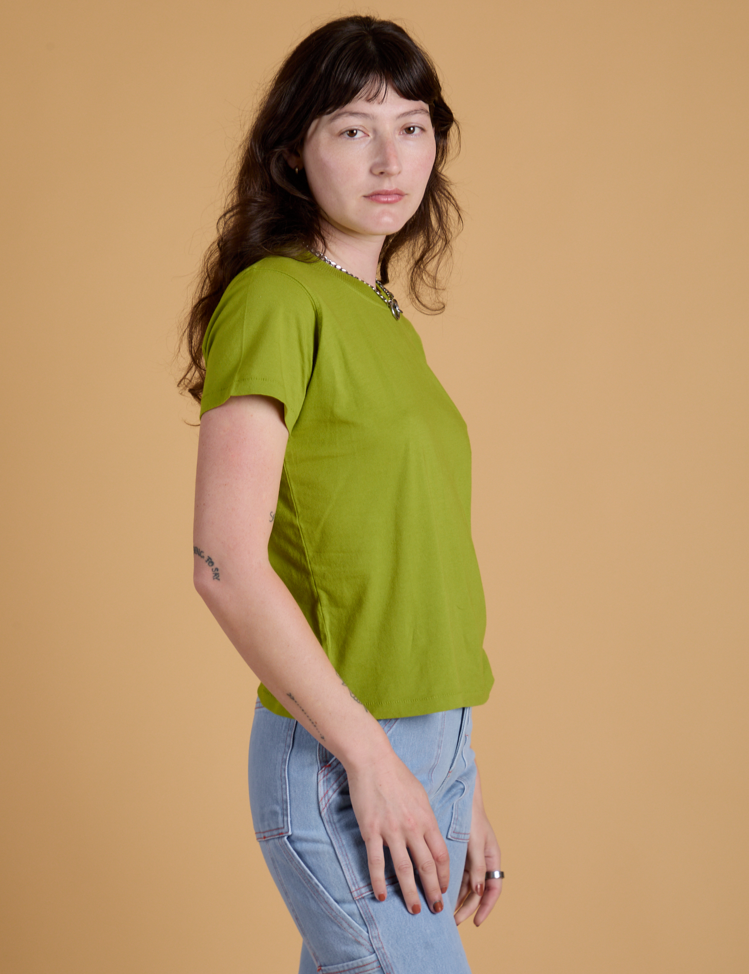Organic Vintage Tee in Gross Green side view on Alex