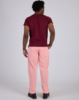 Back view of Work Pants in Baby Pink and red wine Organic Vintage Tee on Isaac