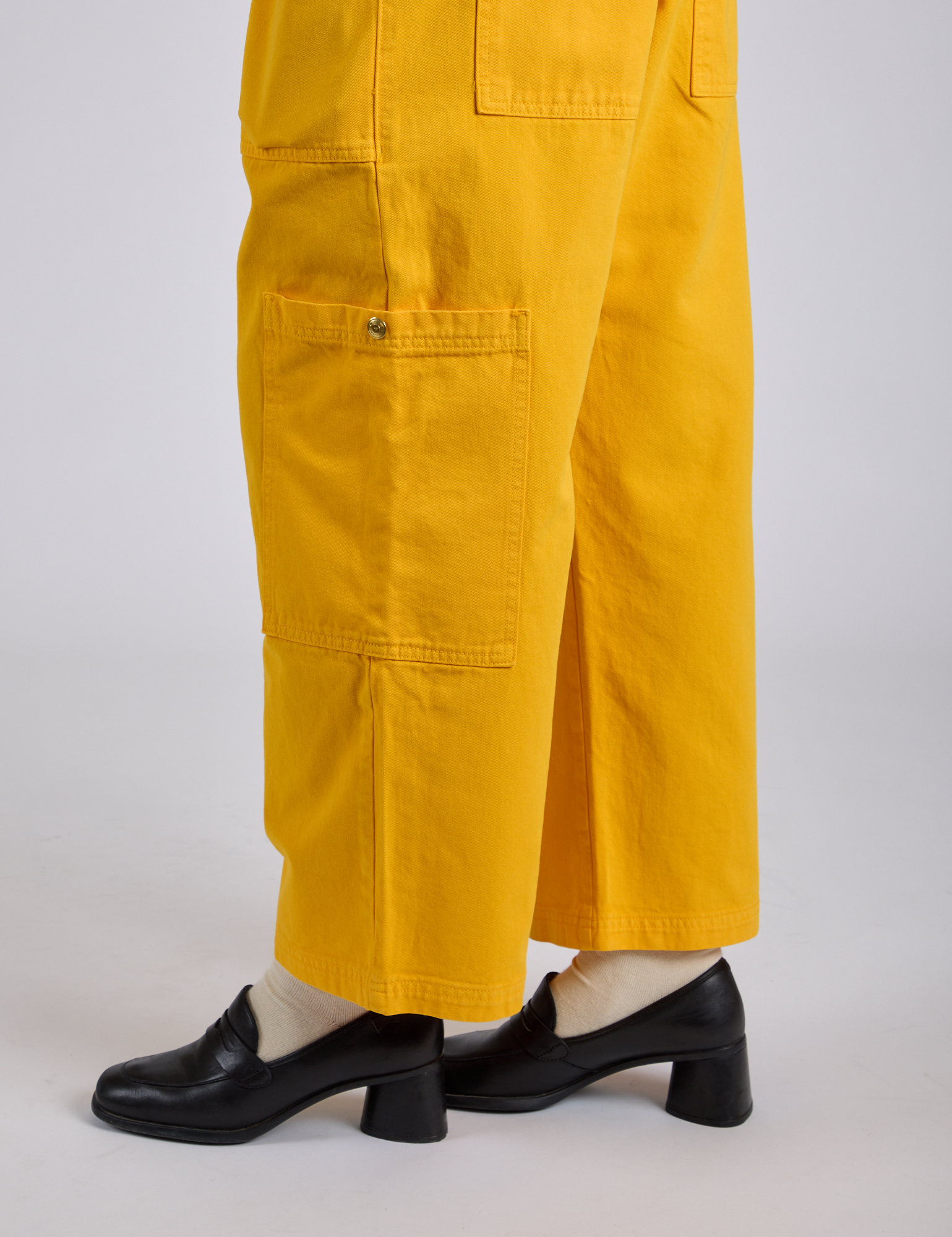 Drop Pocket Cargo Pants in Sunshine Yellow pant leg close up on Kira