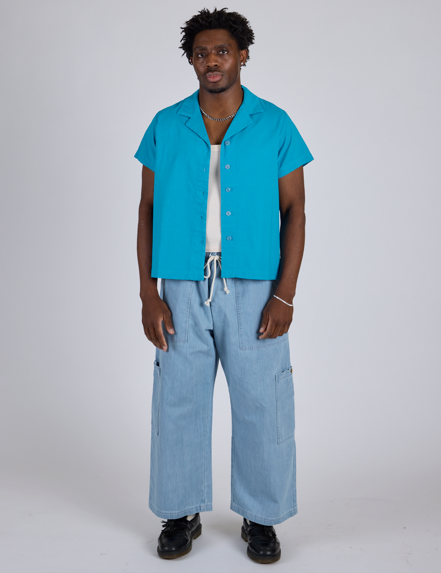 Pantry Button-Up in Hawaiian Blue and light wash Denim Drop Pocket Pants on isaac