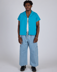 Pantry Button-Up in Hawaiian Blue and light wash Denim Drop Pocket Pants on isaac