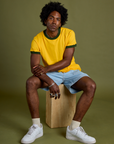 Vintage Ringer Tee in Sunshine Yellow and light wash Carpenter Shorts on Jerrod