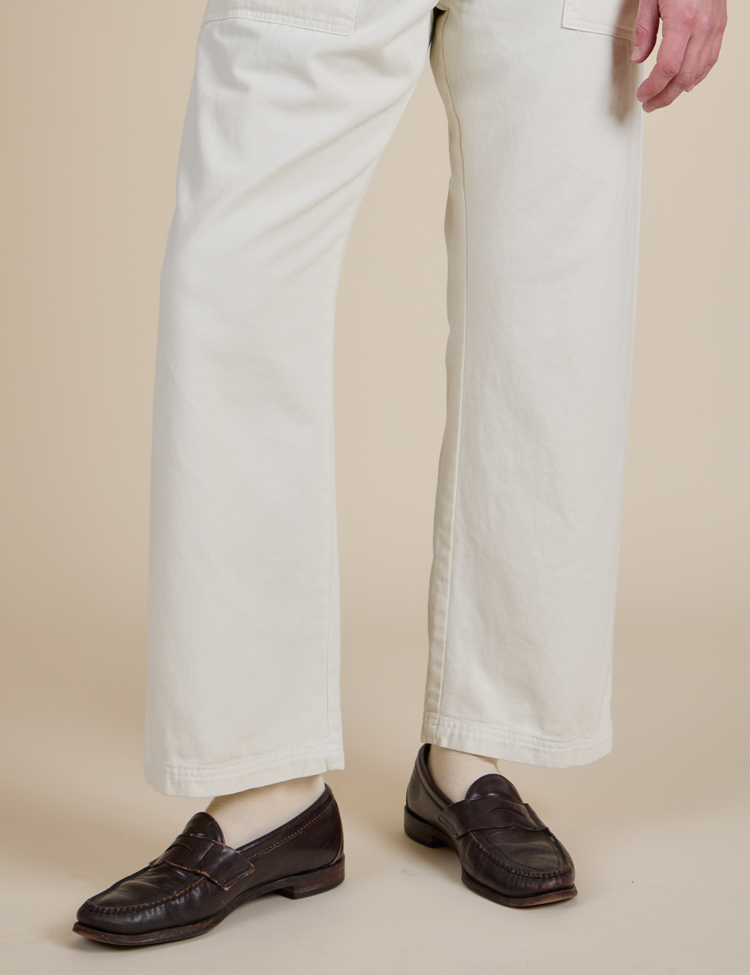 Short Sleeve Jumpsuit in Vintage Tee White pant leg close up on Quinn