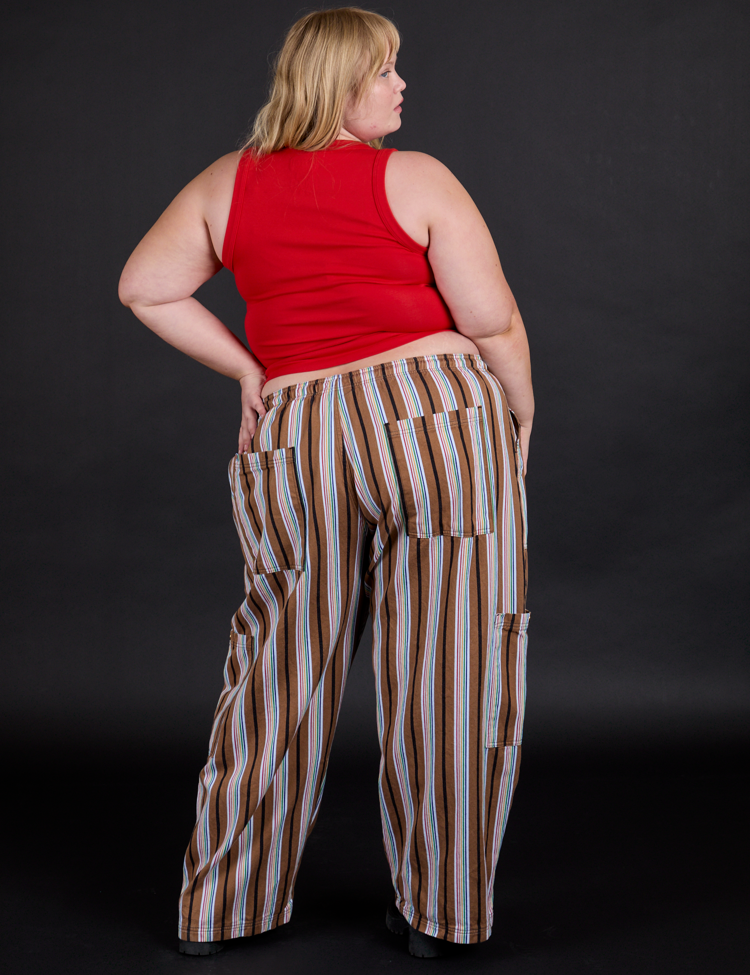 Back view of Striped Drop Pocket Pants in Retro Rainbow and mustang red Tank Top