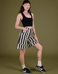 Angled front view of  Longline Work Shorts in Natural and black Cropped Tank on Alex