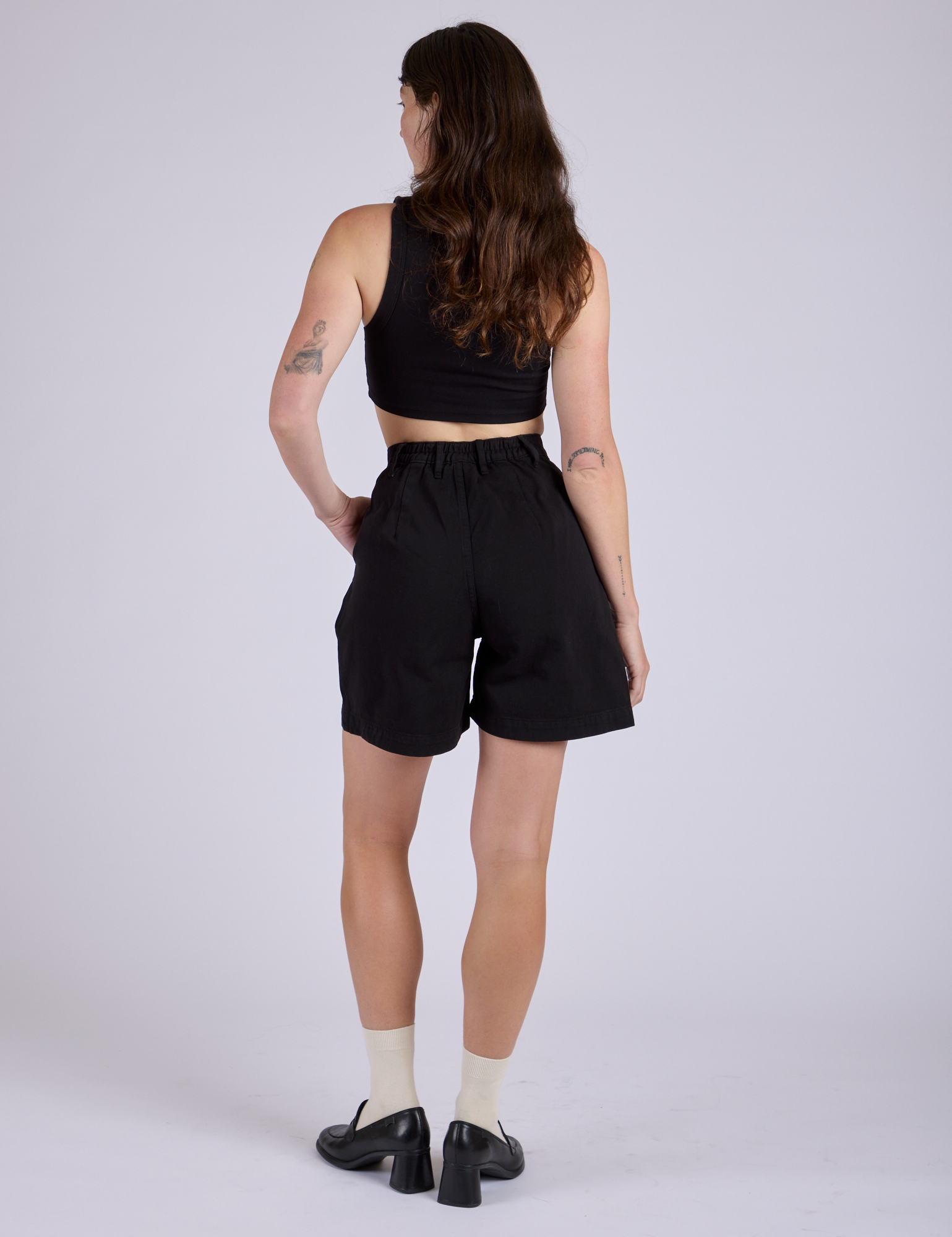 Pleated Trouser Shorts in Basic Black back view on Alex