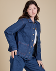 Front angled view of Indigo Denim Work Jacket in Dark Wash on Alex