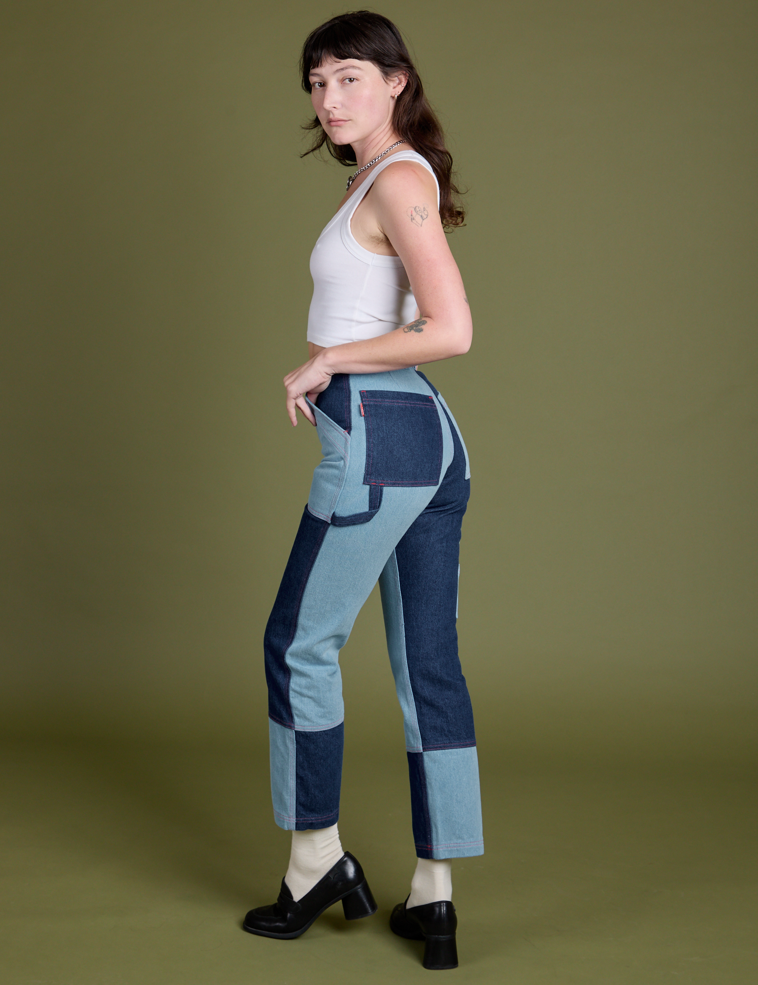 Angled back view of  Mismatched Denim Carpenter Jeans on Alex