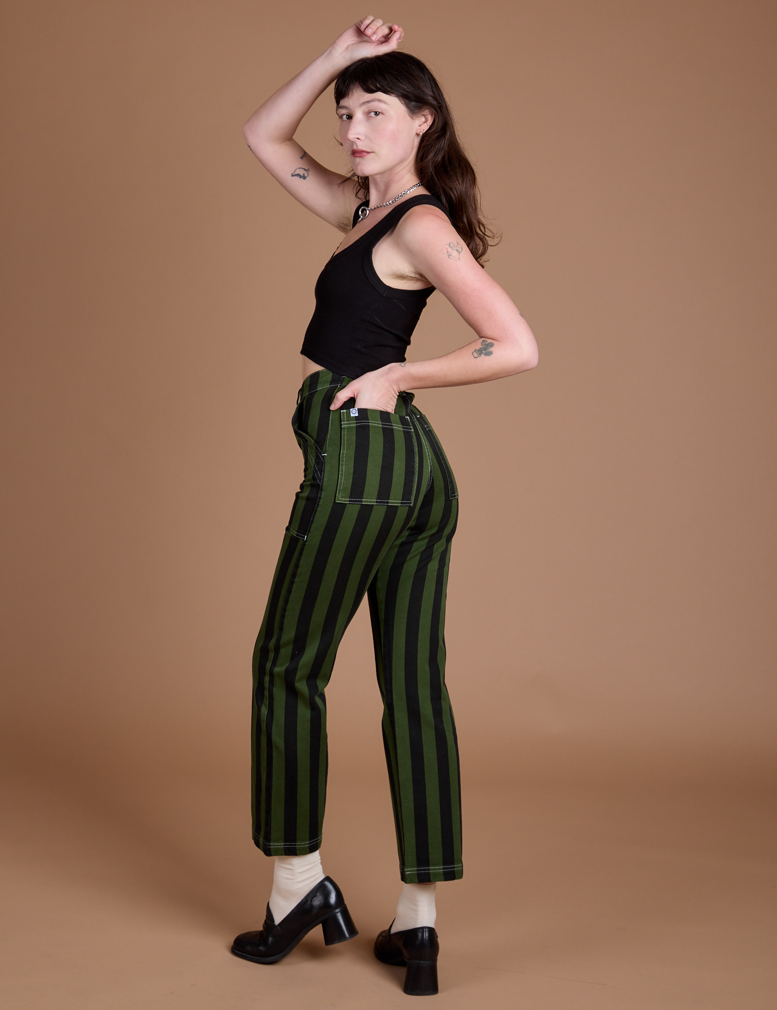 Angled back view of Black Stripe Work Pants in Evergreen on Alex
