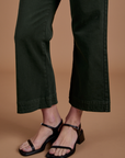 Action Pants in Swamp Green pant leg close up on Alex