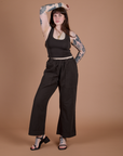 Sydney is 5’9” and wearing M Work Pants in Espresso Brown paired with matching Cropped Tank
