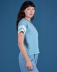 Painted Burly Tee in Baby Blue side view on Alex