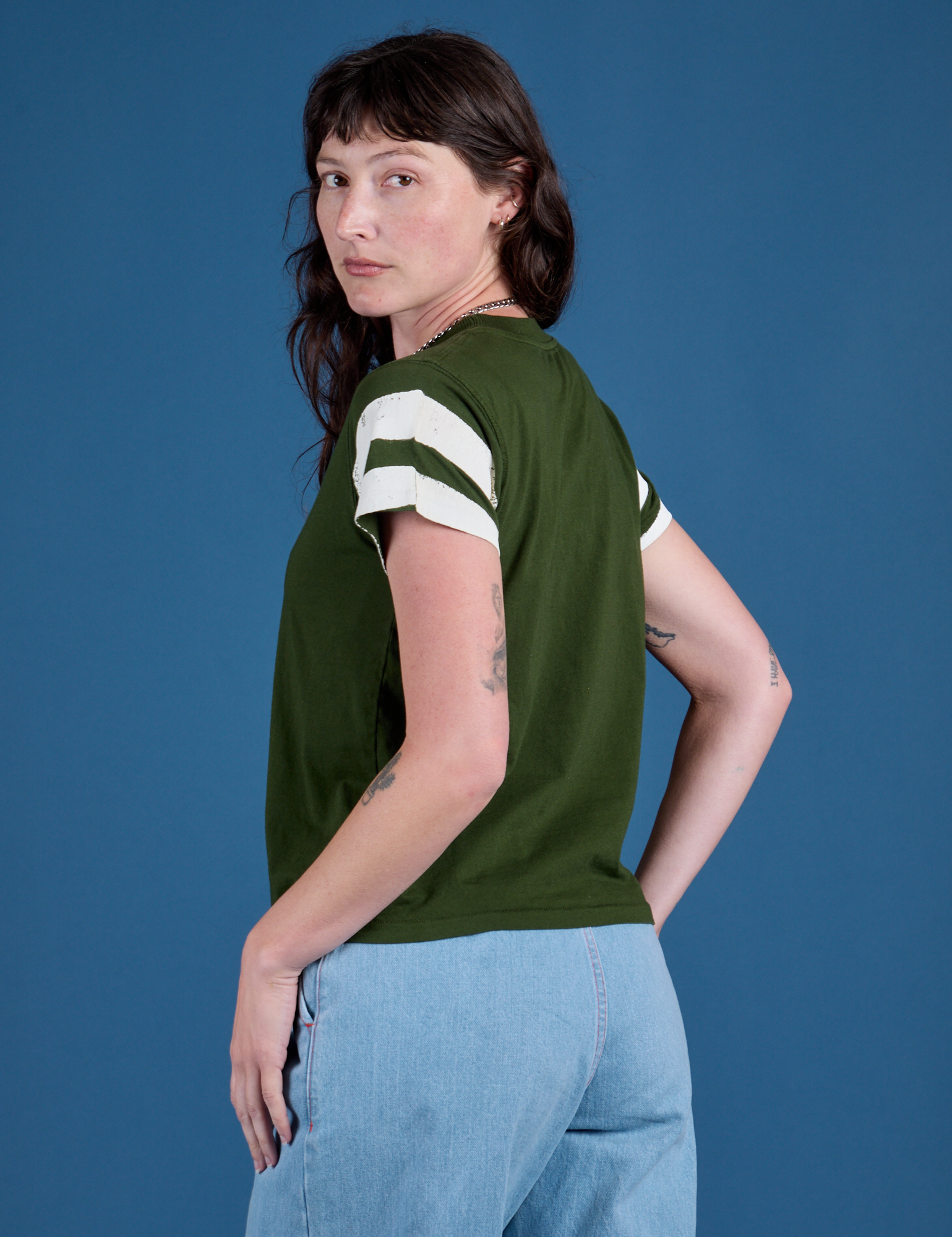 Angled back view of Painted Vintage Tee in Evergreen  on Alex