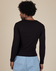 Long Sleeve Baby Tee in Basic Black back view on Jerrod