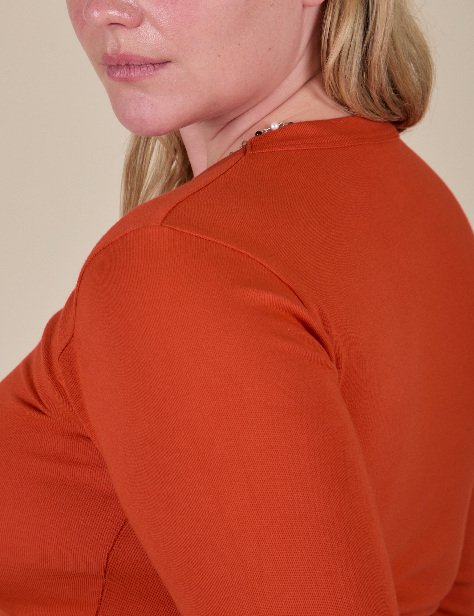 Long Sleeve Baby Tee in Chili Red shoulder close up on Lish