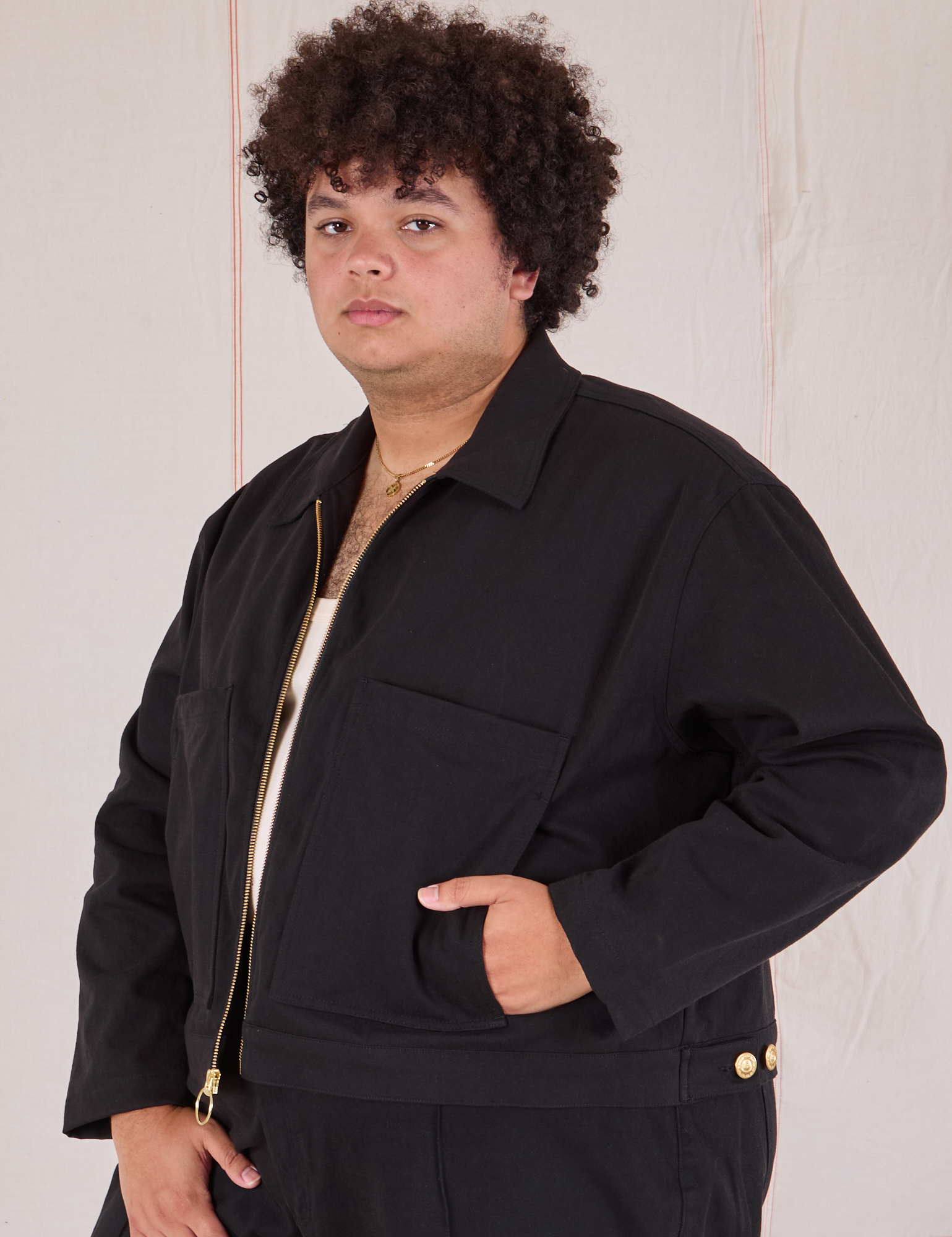 Mechanic Jacket in Basic Black angled view on Miguel
