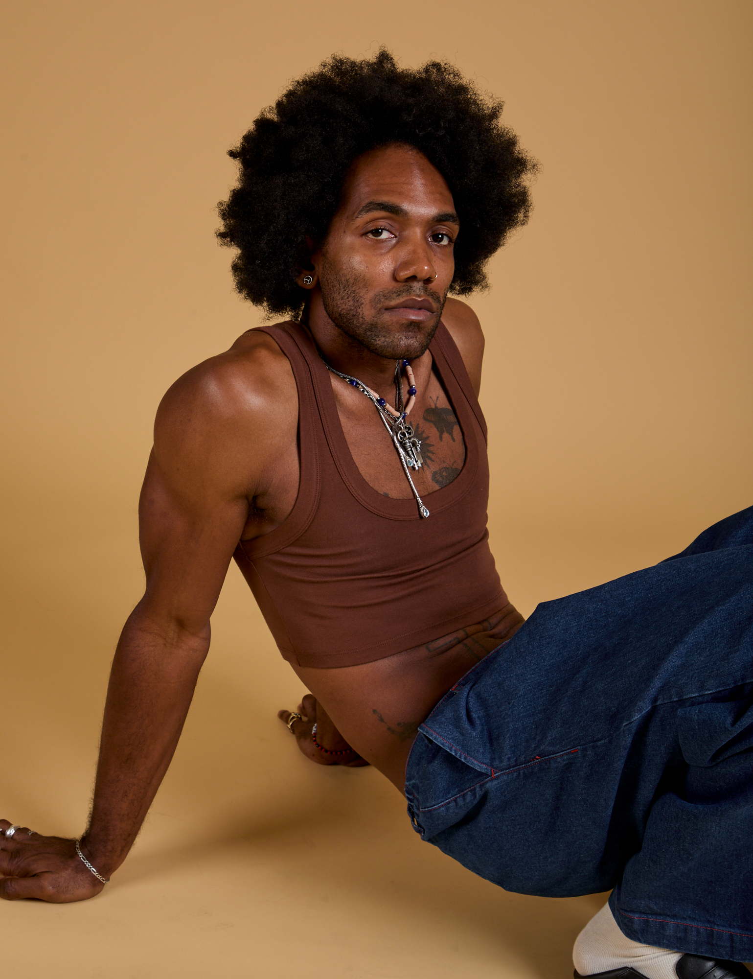 Jerrod is wearing Mini Tank in Fudgesicle Brown
