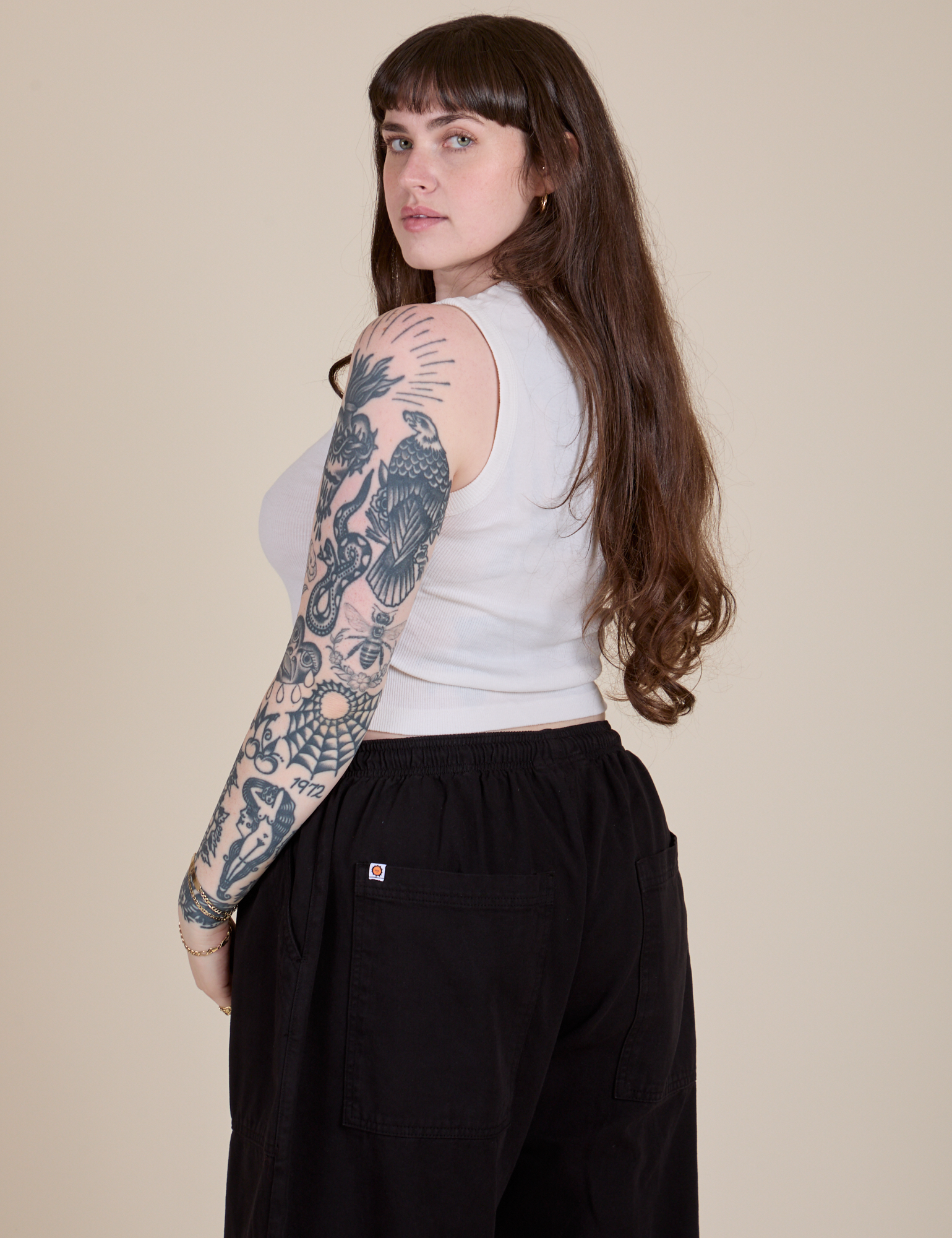 Angled back view of Muscle Tee in Vintage Tee White on Sydney