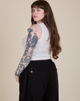 Angled back view of Muscle Tee in Vintage Tee White on Sydney