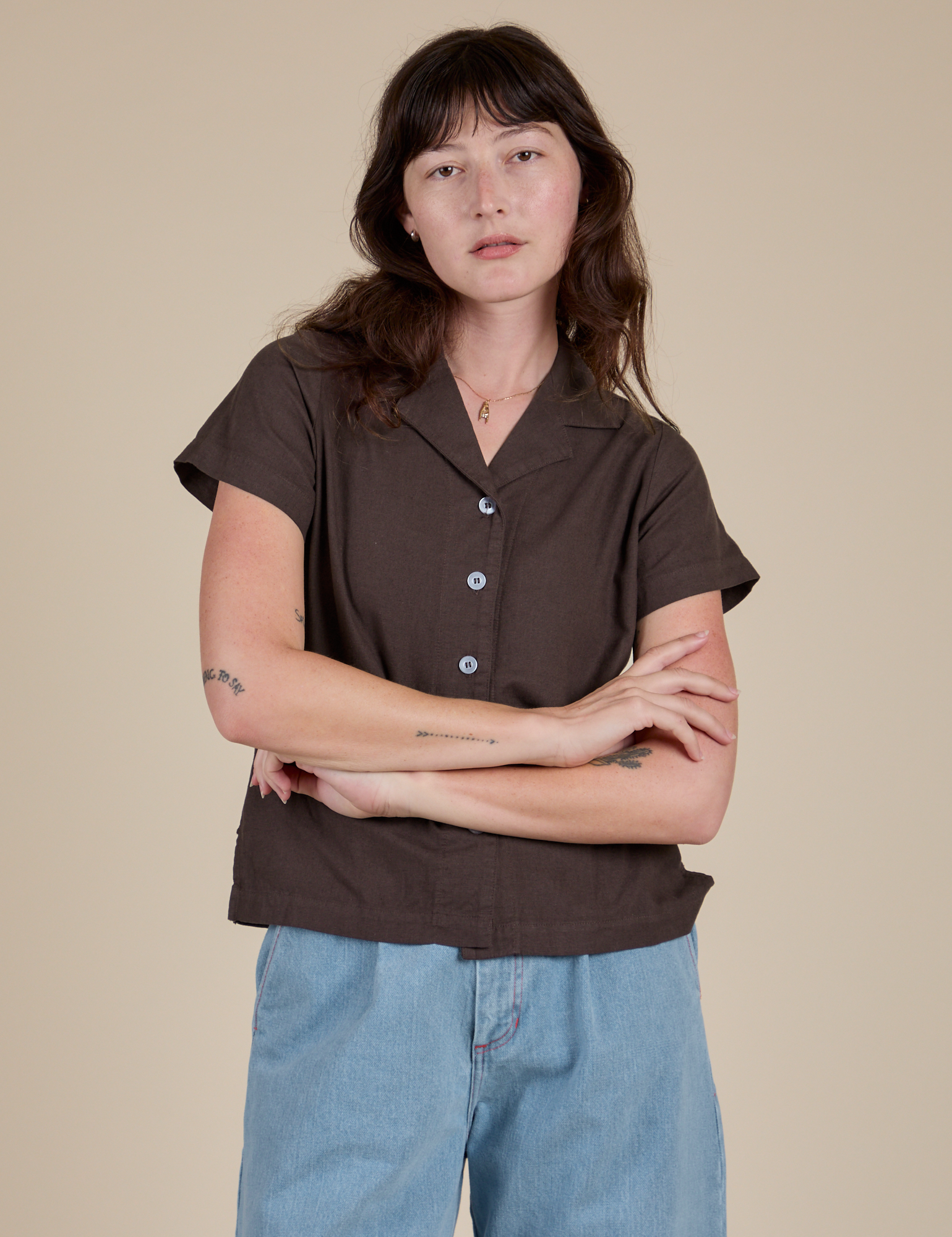 Alex is wearing a buttoned up Pantry Button-Up in Espresso Brown