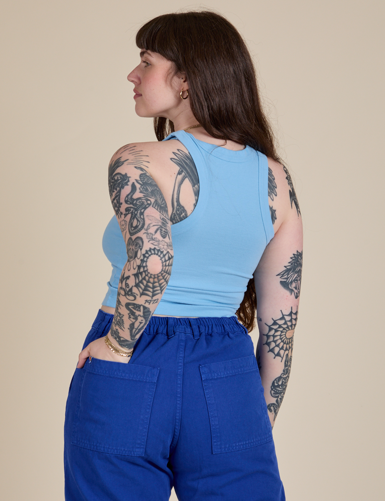 Angled back view of Racerback Tank in Baby Blue on Sydney