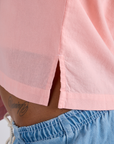 Close up of Pantry Button-Up in Baby Pink side vent on Kira