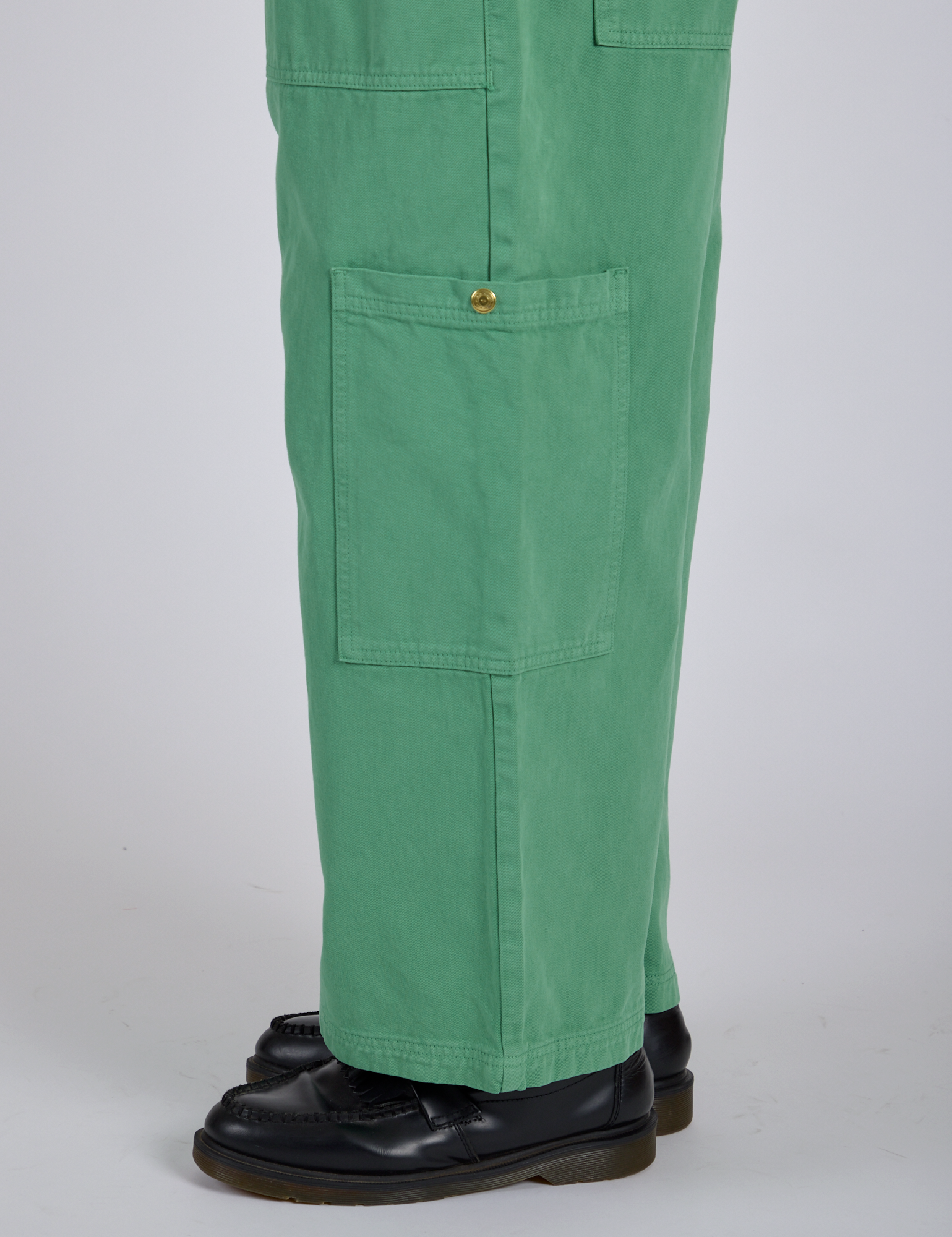 Close up side view of Drop Pocket Cargo Pants in Seafoam Green pant leg on Isaac