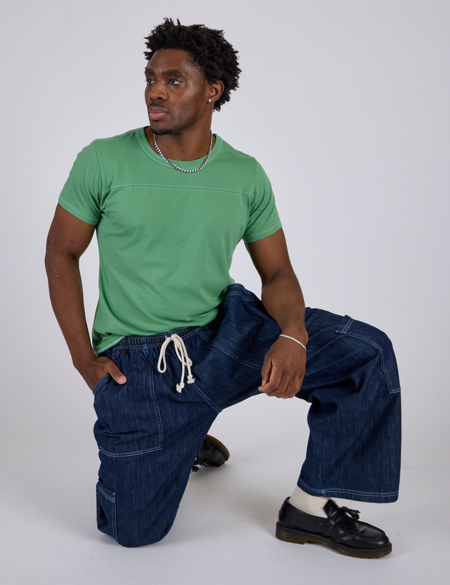 Jr. Varsity Tee in Seafoam Green and dark wash Denim Drop Pocket Pants on Isaac