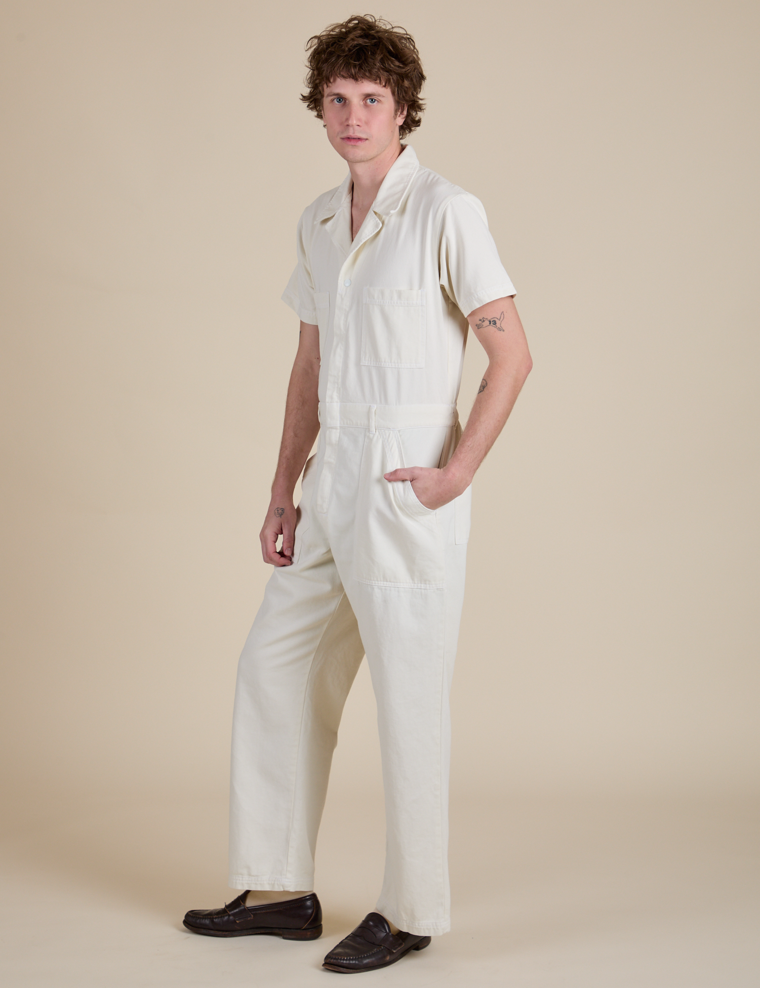 Angled front view of Short Sleeve Jumpsuit in Vintage Tee White on Quinn