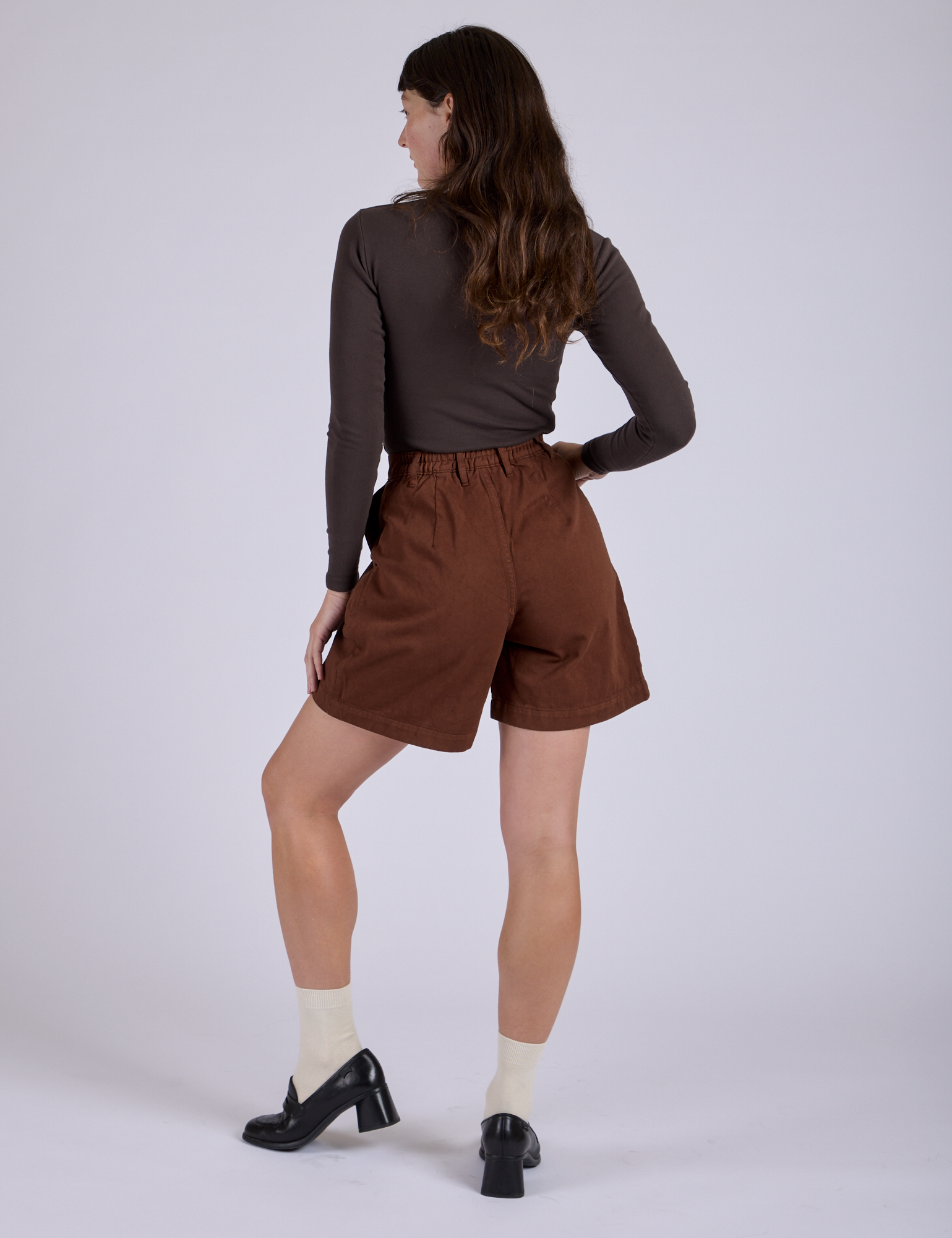 Pleated Trouser Shorts in Fudgesicle Brown back view on Alex